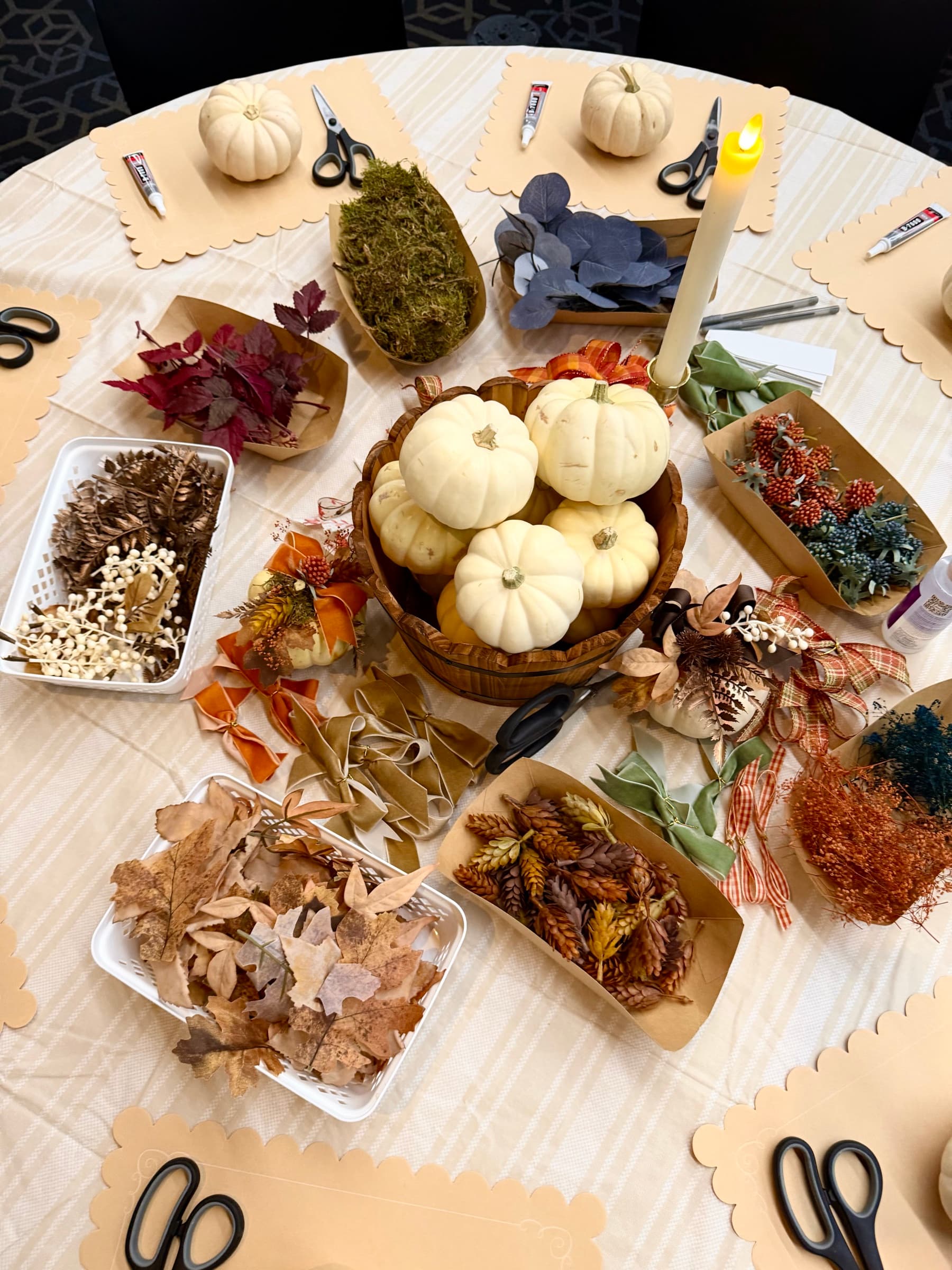 A Create + Gather Collective table set with seasonal craft materials